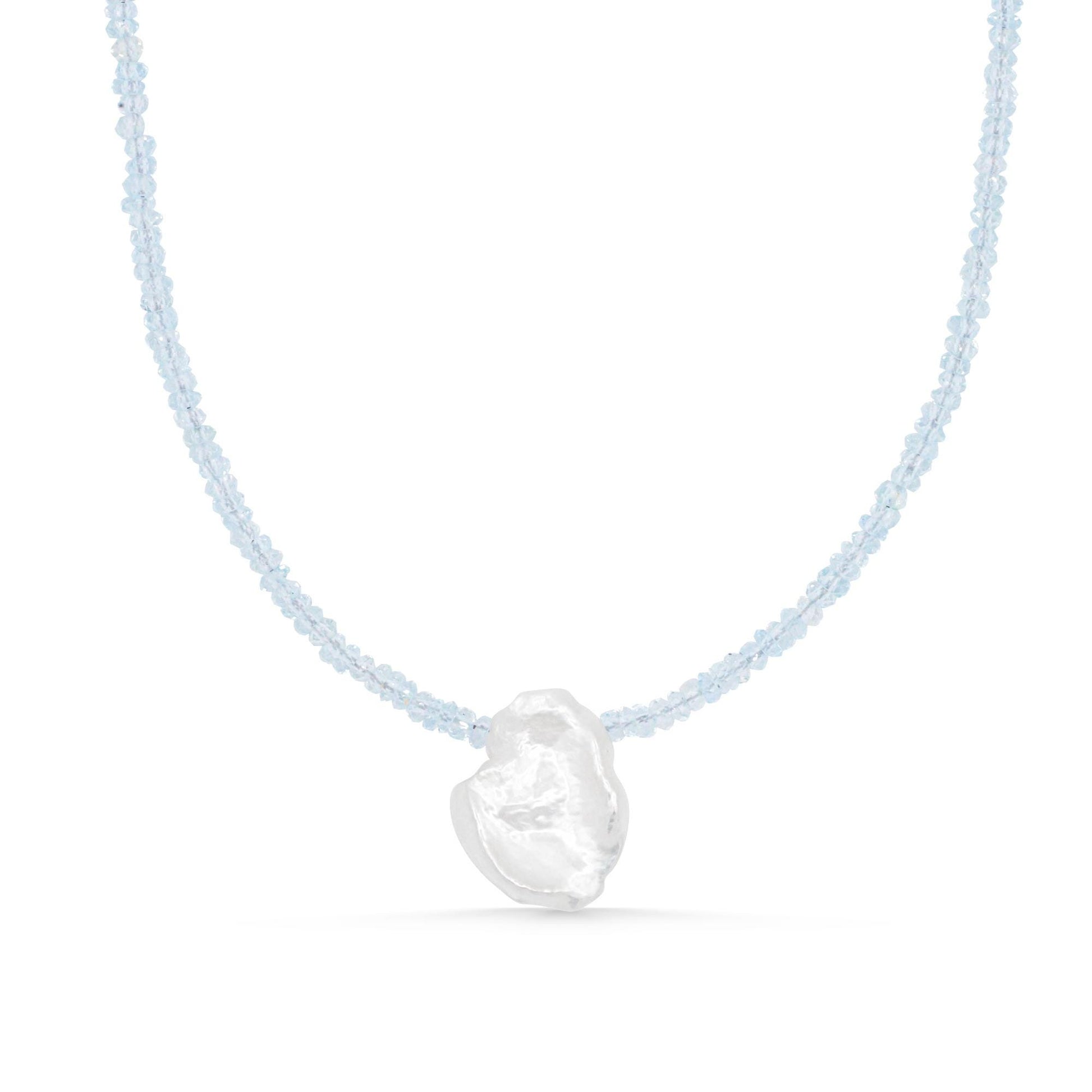 Aquamarine pearl necklace by Earthly Abundance featuring a strand of shimmering aquamarine and pearl beads on a delicate chain.