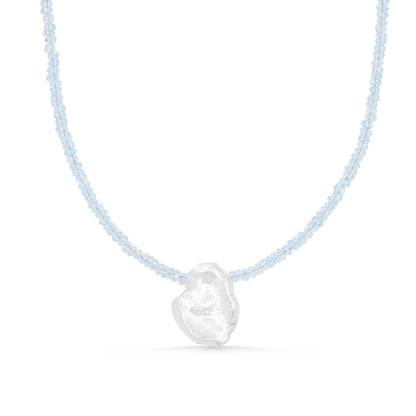 Aquamarine pearl necklace by Earthly Abundance featuring a strand of shimmering aquamarine and pearl beads on a delicate chain.
