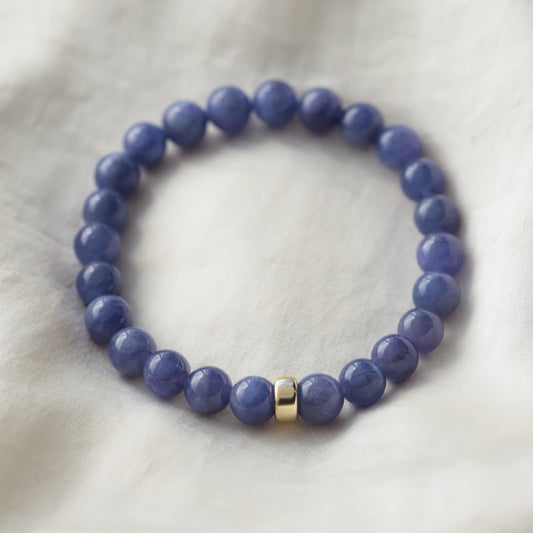 Violet Flame Energy Tanzanite bracelet with silver clasp from Earthly Abundance, featuring polished tanzanite beads.