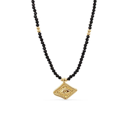 Black Tourmaline necklace from Earthly Abundance featuring a polished black stone pendant on a delicate chain.