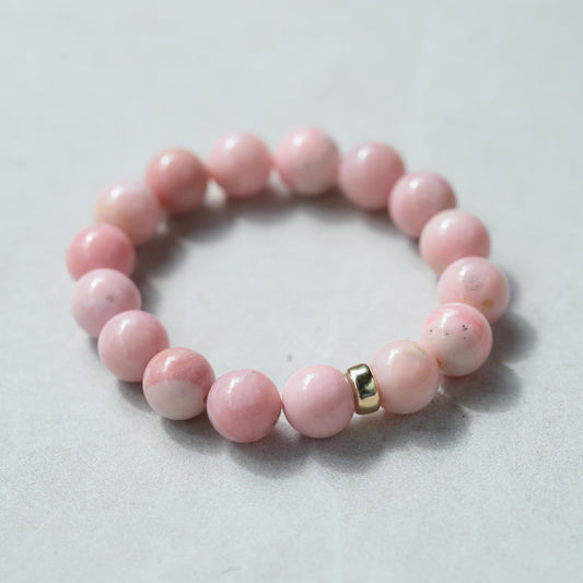 Pink Opal bracelet with 12mm beads featuring a 14K gold clasp by Earthly Abundance, displayed on a soft neutral background.