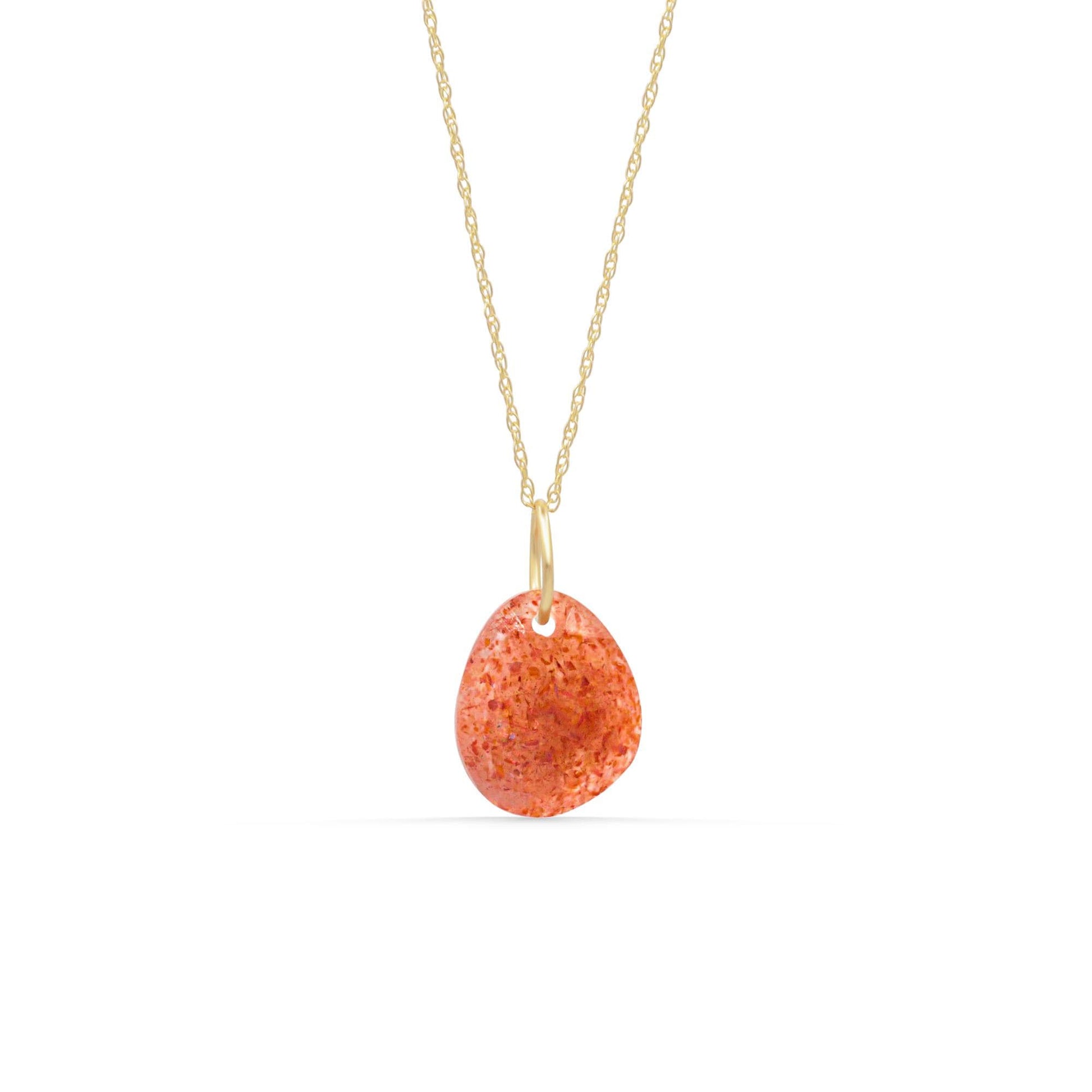 14K Sunstone pendant necklace with a polished, warm orange gemstone hanging from a delicate gold chain.