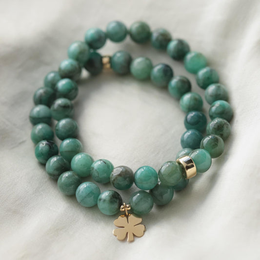 Lucky emerald bracelet in 14K gold from Earthly Abundance, featuring vibrant green emerald stones and delicate gold links.