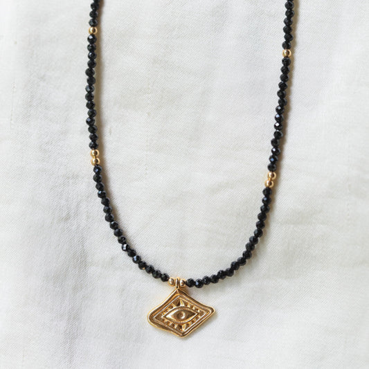 Black Tourmaline necklace from Earthly Abundance featuring a polished black gemstone pendant on a delicate chain.