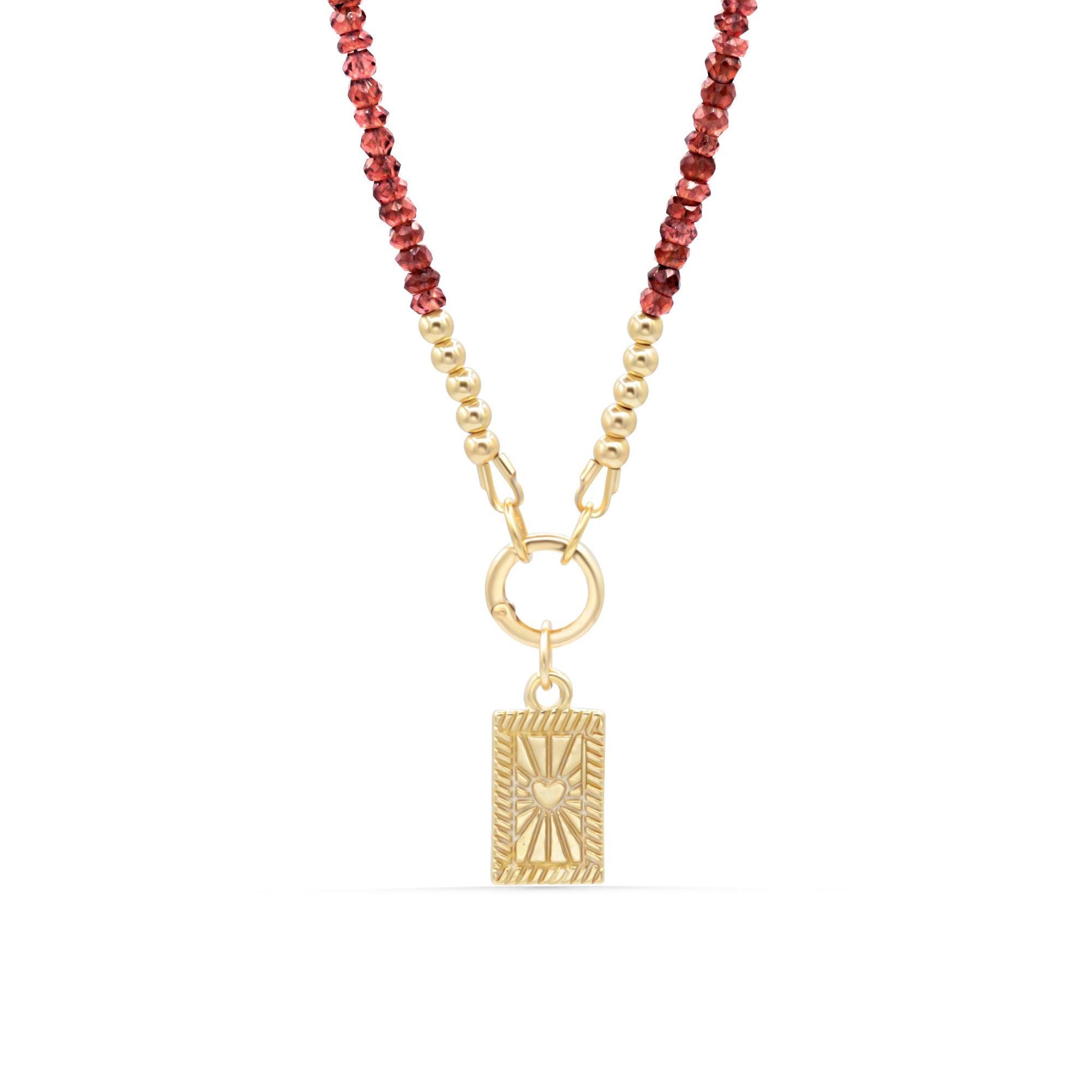 Earthly Abundance Amor Garnet necklace featuring a vibrant red garnet pendant on a delicate silver chain.
