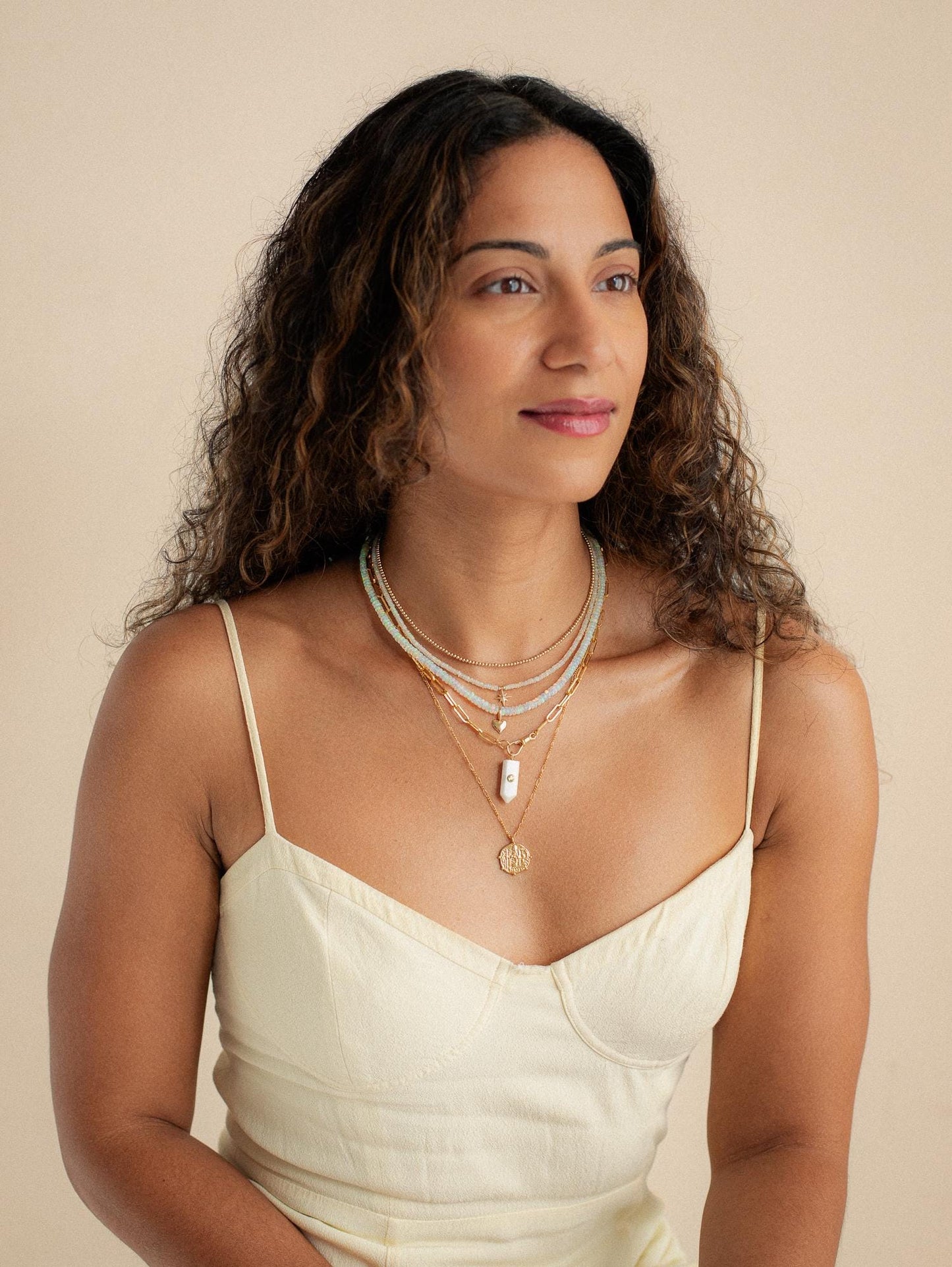 Luminous Path Necklace featuring white agate and peridot stones, with a gold chain from Earthly Abundance.