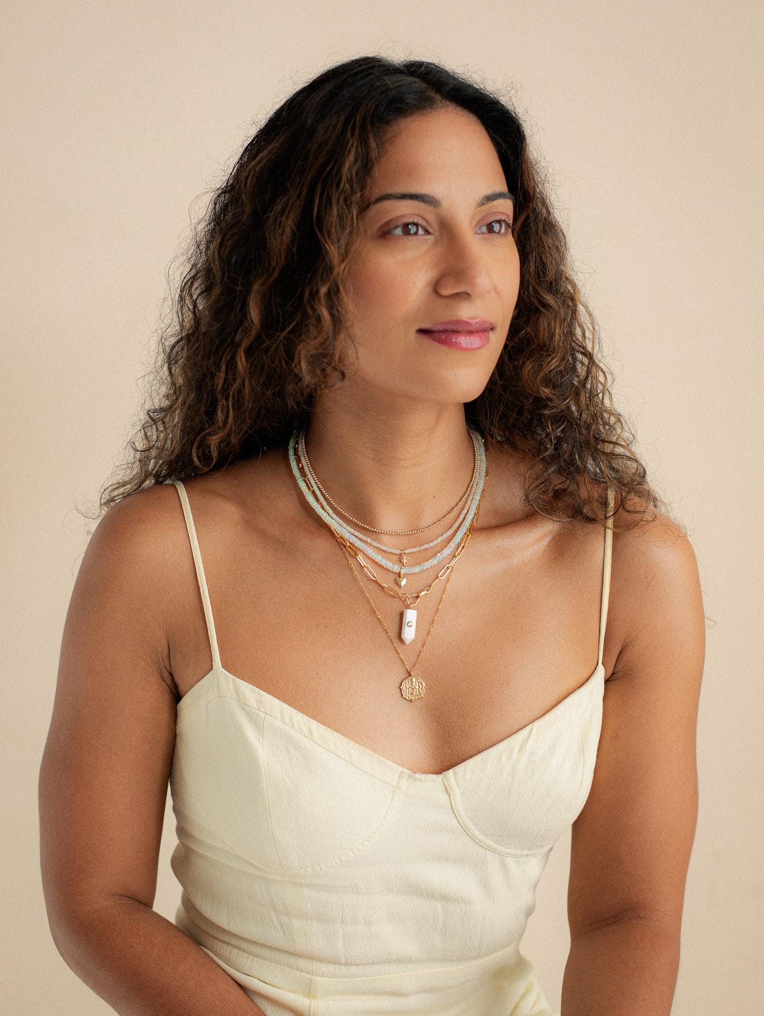 Luminous Path Necklace featuring white agate and peridot stones, with a gold chain from Earthly Abundance.