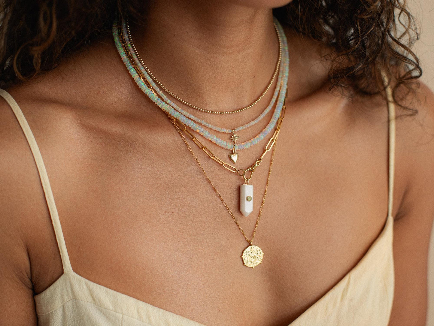 Luminous Path Necklace featuring white agate and peridot gemstones from Earthly Abundance, displayed on a neutral background.