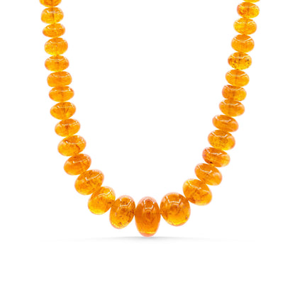 Spessartite Garnet necklace with 14K gold chain from Earthly Abundance, featuring vibrant orange-red gemstones on a delicate chain.