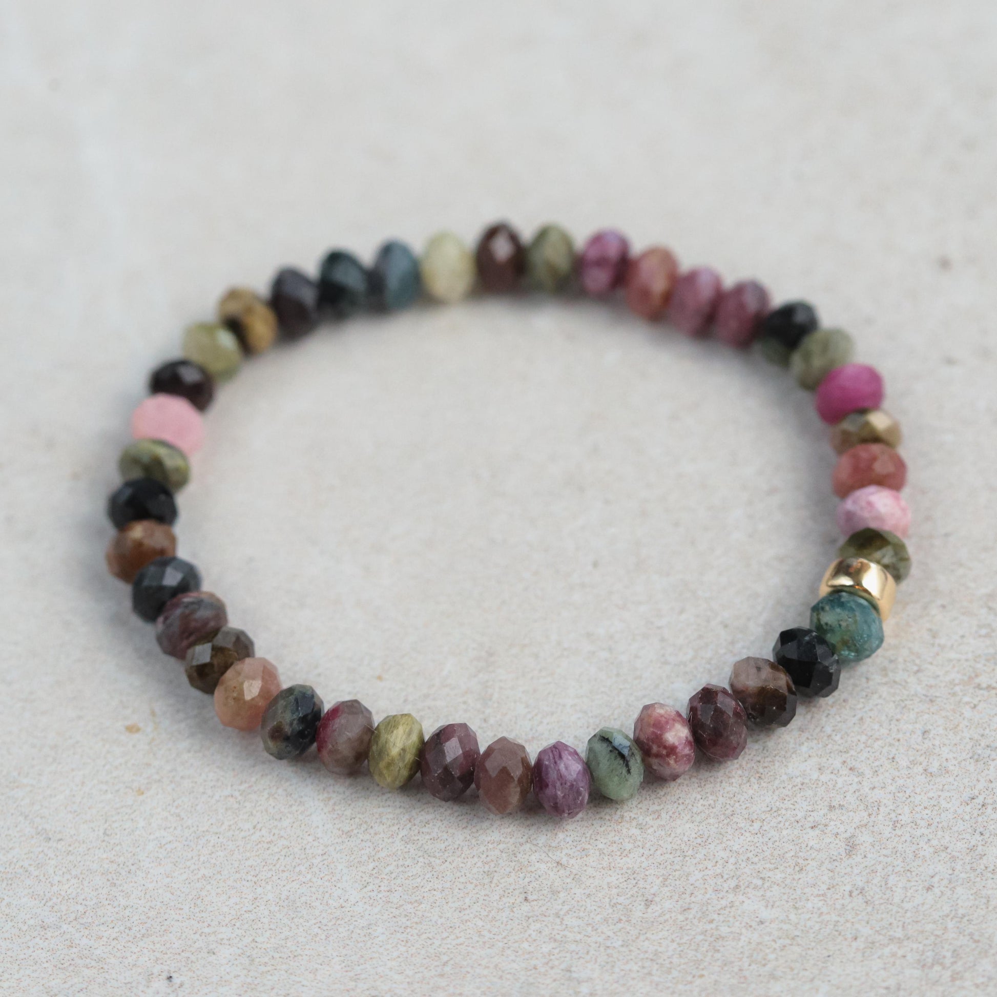Mixed tourmaline bracelet by Earthly Abundance featuring colorful gemstone beads on a stretch cord.