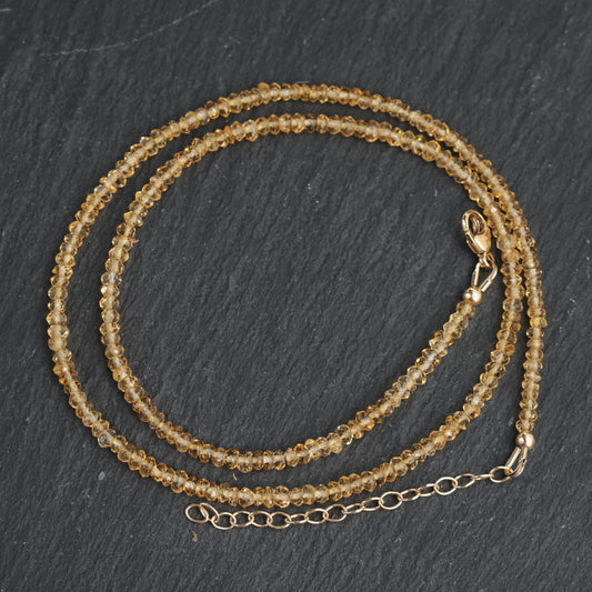 Genuine citrine necklace with 14K gold chain from Earthly Abundance, featuring a large yellow gemstone pendant.