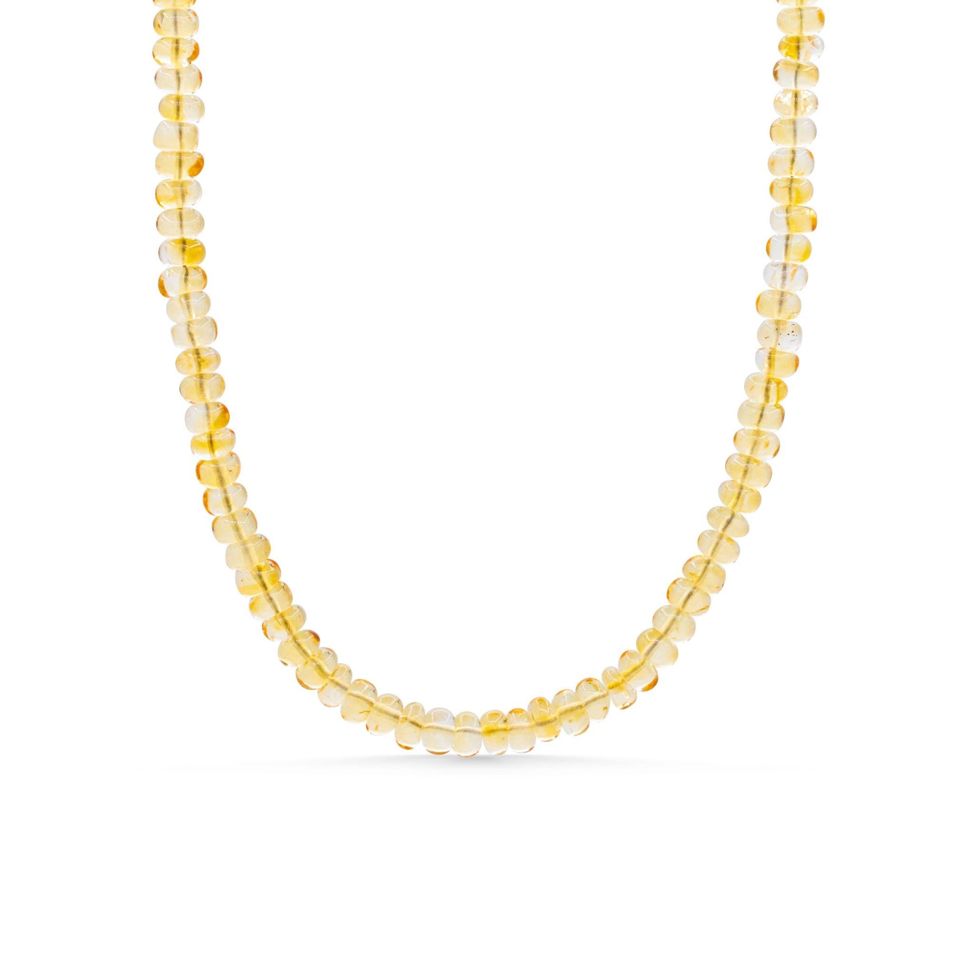 Luminous Citrine Necklace by Earthly Abundance featuring a large, polished citrine gemstone on a delicate gold chain.