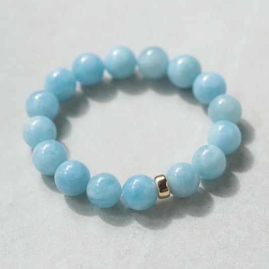 Earthly Abundance Rock Candy Aquamarine bracelet with 12mm beads, showcasing vibrant blue gemstone jewelry.