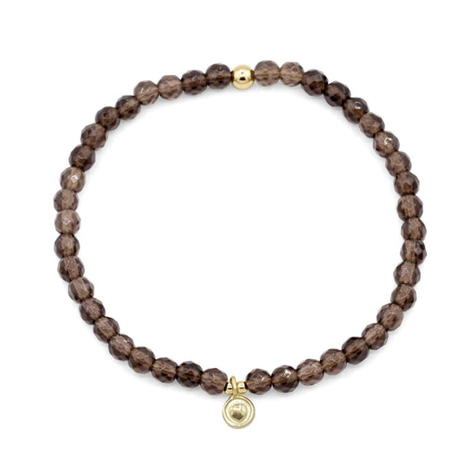 Smoky Quartz bracelet by Earthly Abundance featuring dark, polished smoky quartz beads on an elastic band.