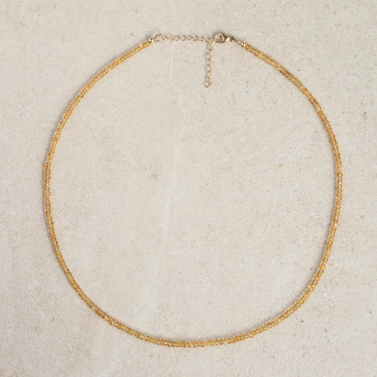 Genuine yellow citrine necklace with 14K gold chain from Earthly Abundance, featuring a polished citrine pendant.