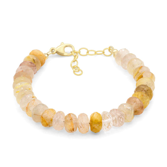 Golden rutilated quartz bracelet featuring golden needle-like inclusions, crafted by Earthly Abundance, on a neutral background.