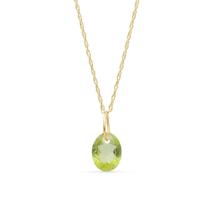 14K Peridot pendant necklace featuring a vibrant green gemstone on a delicate chain by Earthly Abundance