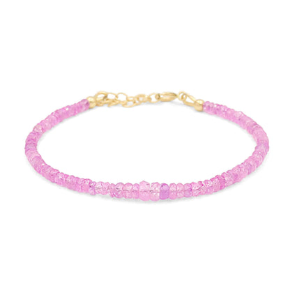 Baby pink sapphire bracelet in 14K gold featuring delicate pink sapphires, elegant jewelry piece from Earthly Abundance.