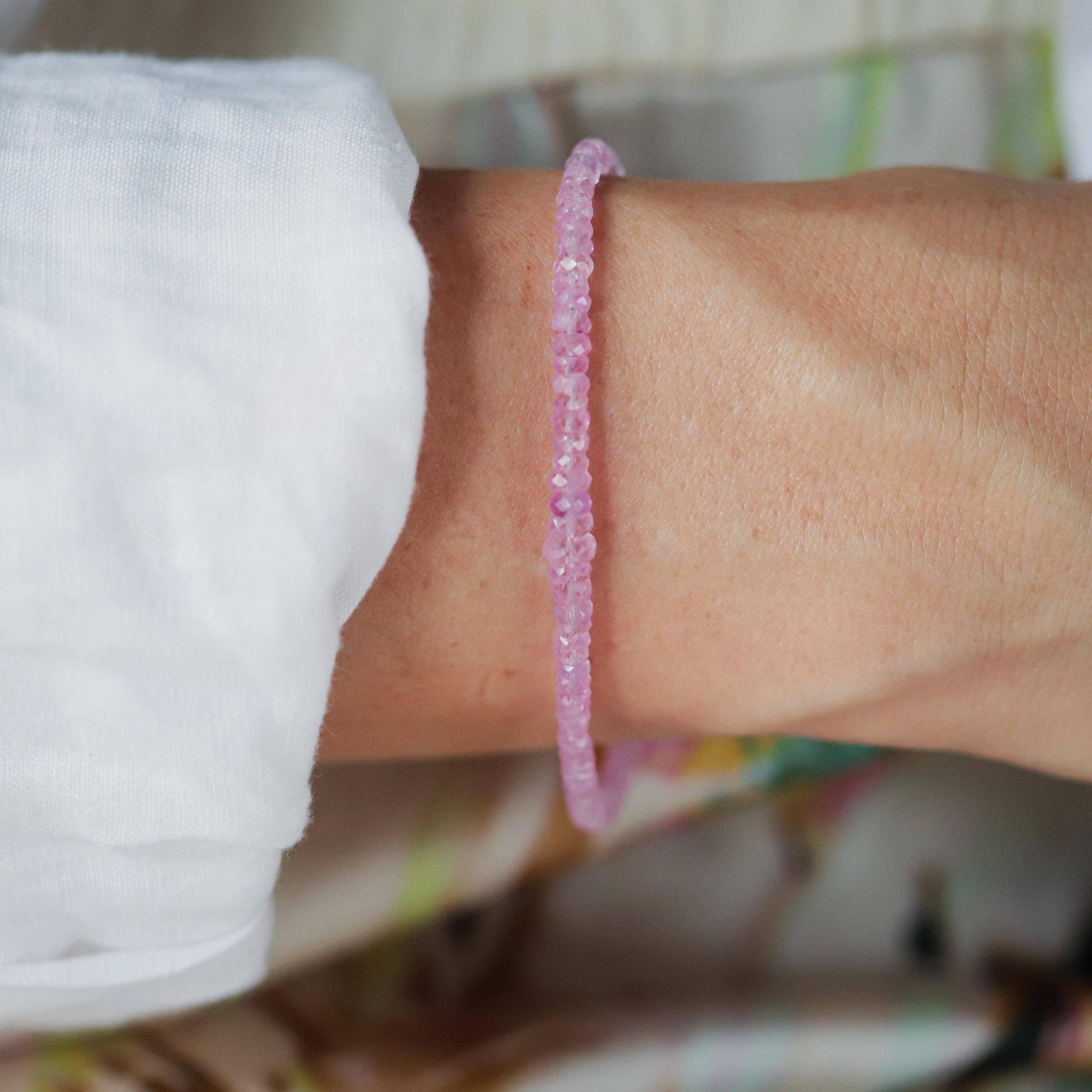 Baby pink sapphire bracelet in 14K gold featuring a delicate design, showcasing the elegant Earthly Abundance jewelry.
