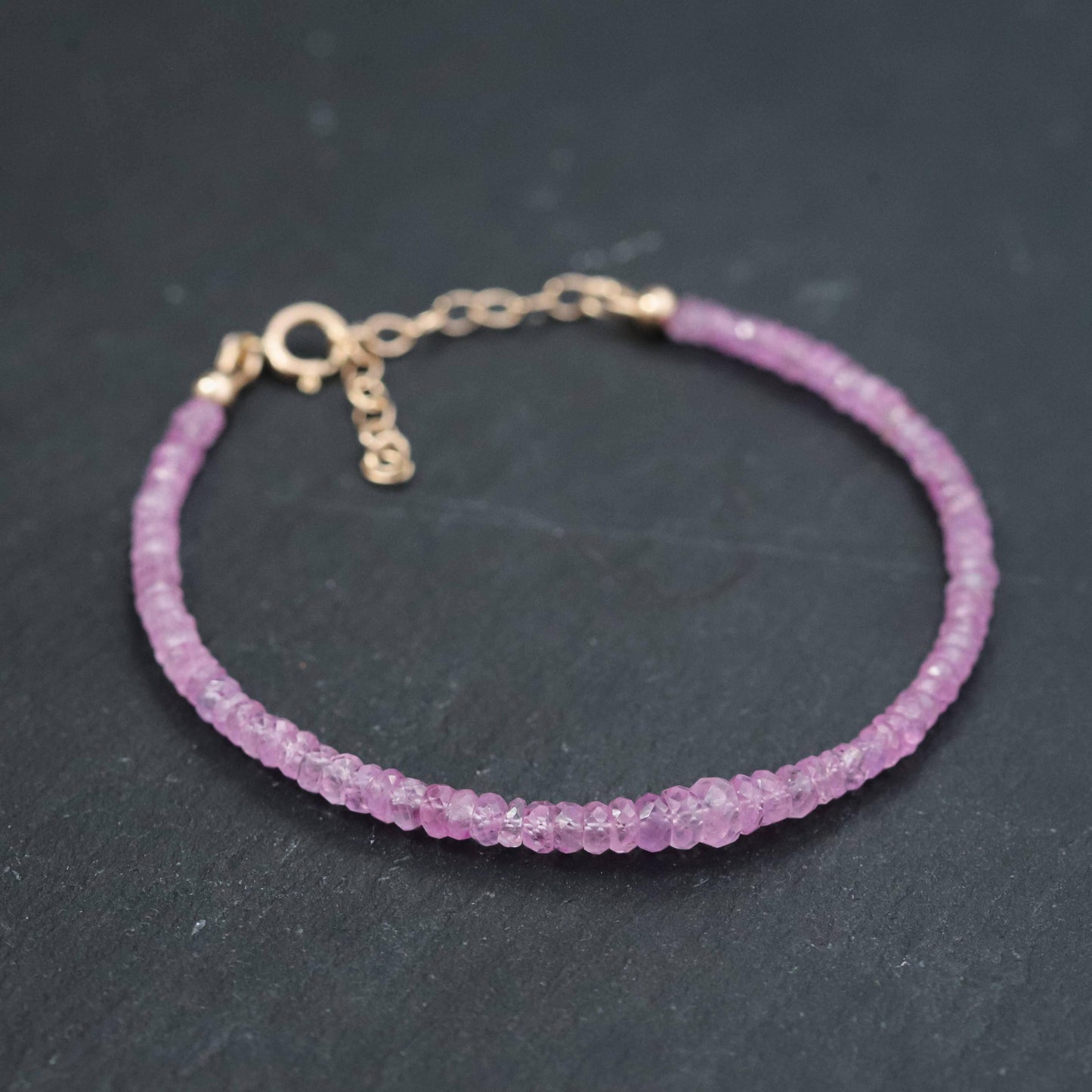 Baby pink sapphire bracelet in 14K gold with delicate chain and pink sapphire stones, from Earthly Abundance.