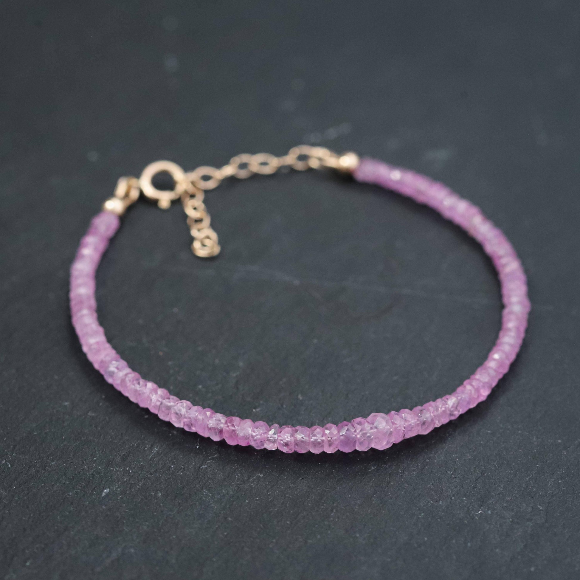 Baby pink sapphire bracelet in 14K gold with delicate chain and pink sapphire stones, from Earthly Abundance.