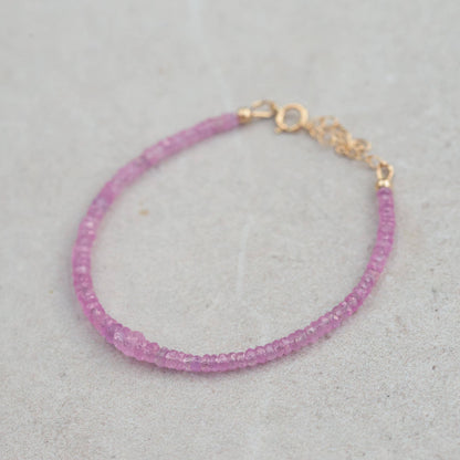 Baby pink sapphire bracelet in 14K gold from Earthly Abundance, featuring delicate pink sapphires and a refined design.