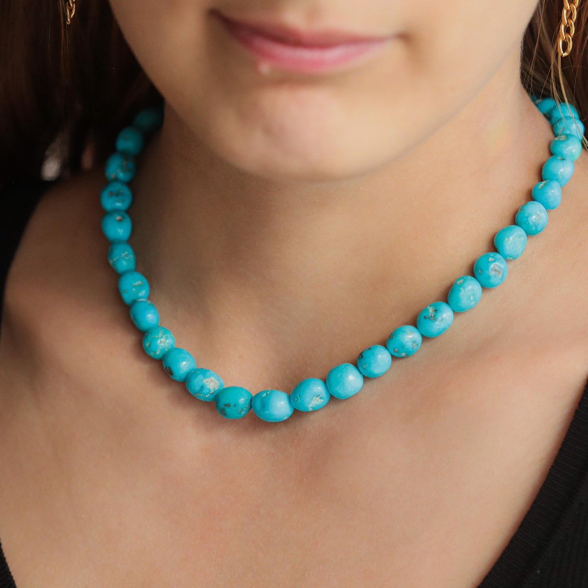 14K Sleeping Beauty turquoise ring by Earthly Abundance featuring a vibrant turquoise gemstone and elegant gold setting