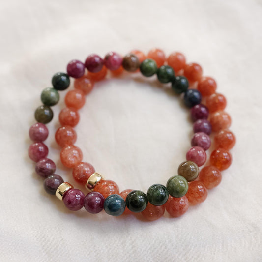Warm orange Sunstone bracelet with 8mm beads from Earthly Abundance, featuring vibrant, polished sunstone gemstones on a stretchy band.