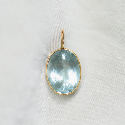 Aquamarine and solid 14K gold ocean-inspired pendant necklace by Earthly Abundance, featuring a vibrant aquamarine gemstone.