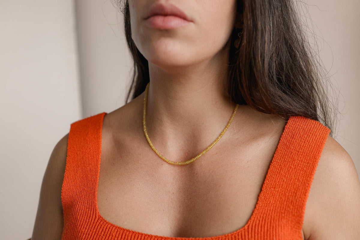 Yellow sapphire necklace in 14K gold featuring a vibrant yellow gemstone, elegant jewelry piece from Earthly Abundance.
