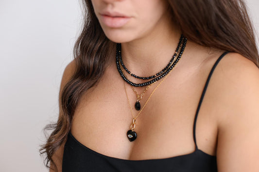Vanta Black Spinel Necklace by Earthly Abundance Jewelry featuring a sleek black spinel pendant on a delicate chain.