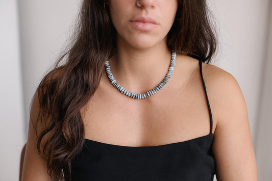 Dendritic Opal Necklace featuring a polished, natural stone pendant on a silver chain from Earthly Abundance.