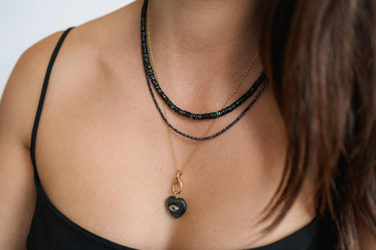 Black Ethiopian Opal beaded necklace featuring vibrant, polished stones on a delicate string, designed by Earthly Abundance.