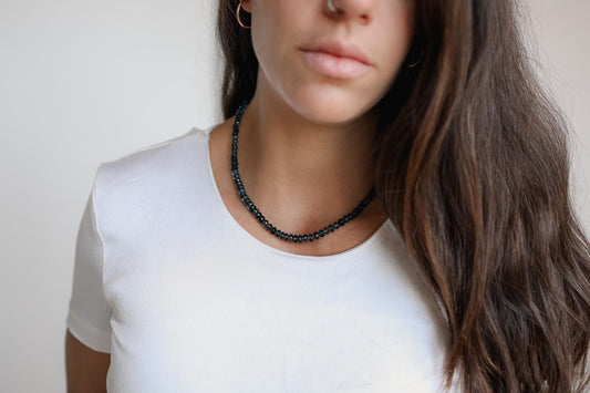 London Blue Topaz necklace with 14K gold chain, featuring a vibrant blue gemstone pendant by Earthly Abundance.