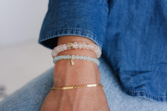Aquamarine and diamond lighthouse bracelet in solid 14K gold with detailed lighthouse charm, crafted by Earthly Abundance.
