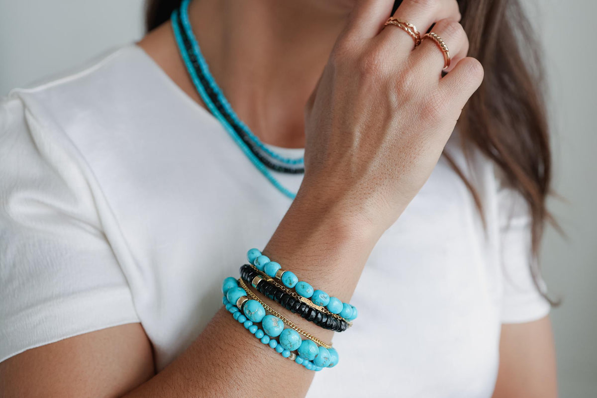 Black Tourmaline Heishi bracelet by Earthly Abundance featuring small, rounded black tourmaline beads on a stretch cord.