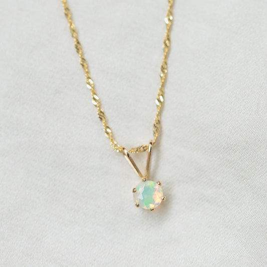 Ethiopian Opal Necklace with vibrant, iridescent stones on a delicate chain, crafted by Earthly Abundance.