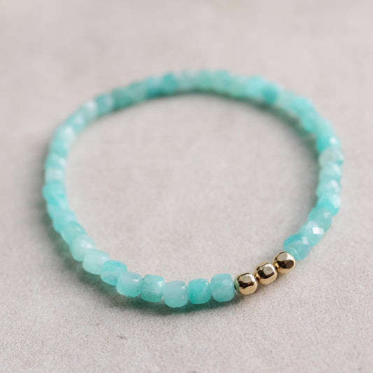 Amazonite cube bracelet by Earthly Abundance featuring smooth blue-green gemstone cubes on an elastic band.
