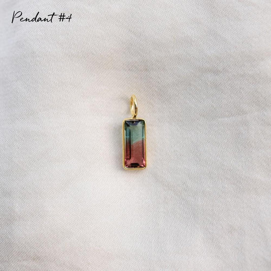One of a Kind Bi-Color Tourmaline pendant by Earthly Abundance, featuring vibrant, multicolored gemstone set in a delicate silver setting.