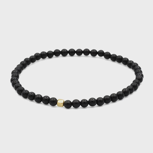 Men’s black Tourmaline cube bracelet featuring sleek black stones on an elastic band, by Earthly Abundance.