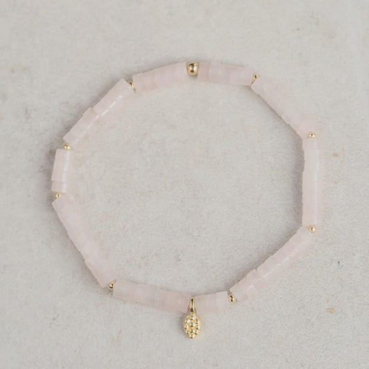 Rose quartz mosaic bracelet by Earthly Abundance featuring pink stone beads and intricate design on elastic band.