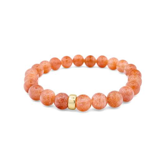 Warm orange Sunstone bracelet with 8mm beads from Earthly Abundance, showcasing vibrant, polished gemstone stones on a neutral background.