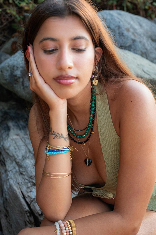 Earthly Abundance Midnight Muse Spinel Necklace featuring a dark, sparkling spinel gemstone on a delicate chain.