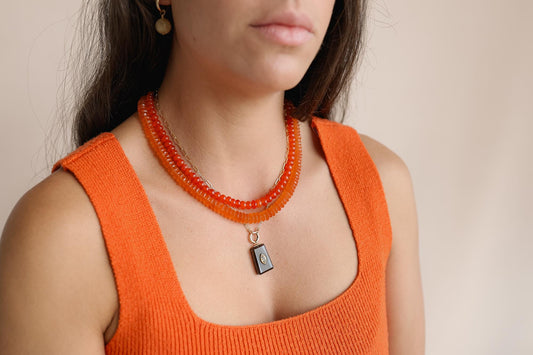 Tangerine Dream Carnelian Necklace by Earthly Abundance featuring vibrant orange carnelian beads on a delicate chain.