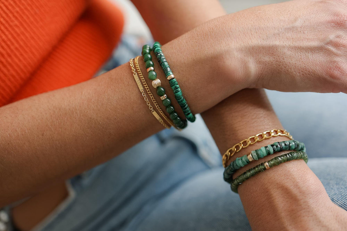 Green Apatite Heishi bracelet featuring small, smooth gemstone beads on a stretch cord, crafted by Earthly Abundance.
