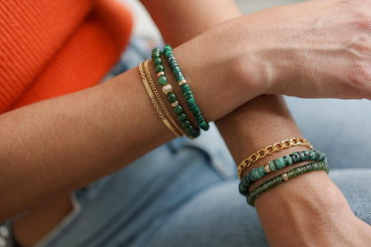 Green Apatite Heishi bracelet featuring small, smooth gemstone beads on a stretch cord, crafted by Earthly Abundance.