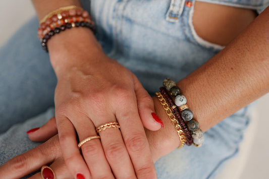 Earthly Abundance garnet Heishi bracelet featuring small, smooth red garnet beads strung together on a flexible cord.