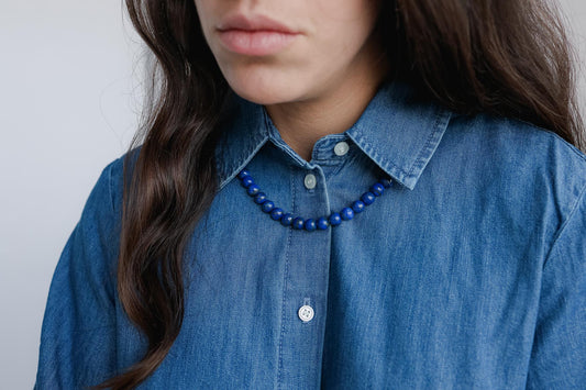 Royal Lapis Necklace featuring 10mm lapis lazuli beads from Earthly Abundance, showcasing vibrant blue stones on a delicate silver chain.