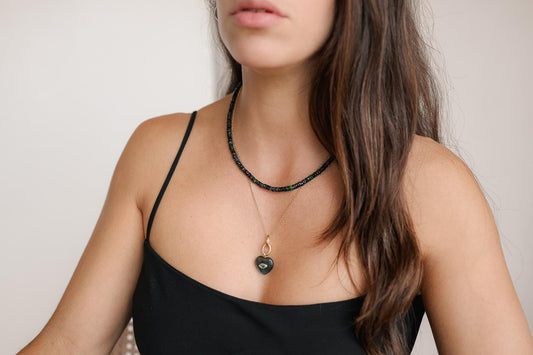 Black Ethiopian Opal beaded necklace with polished black stones and intricate beading, crafted by Earthly Abundance.