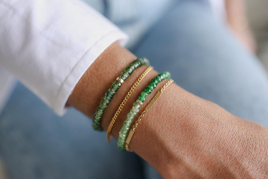 Green Apatite Heishi bracelet featuring small, smooth gemstone beads from Earthly Abundance arranged in a stylish bracelet.